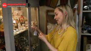  Hettie Jago examines various pieces of jewelry displayed in a store, showcasing her interest in the items.