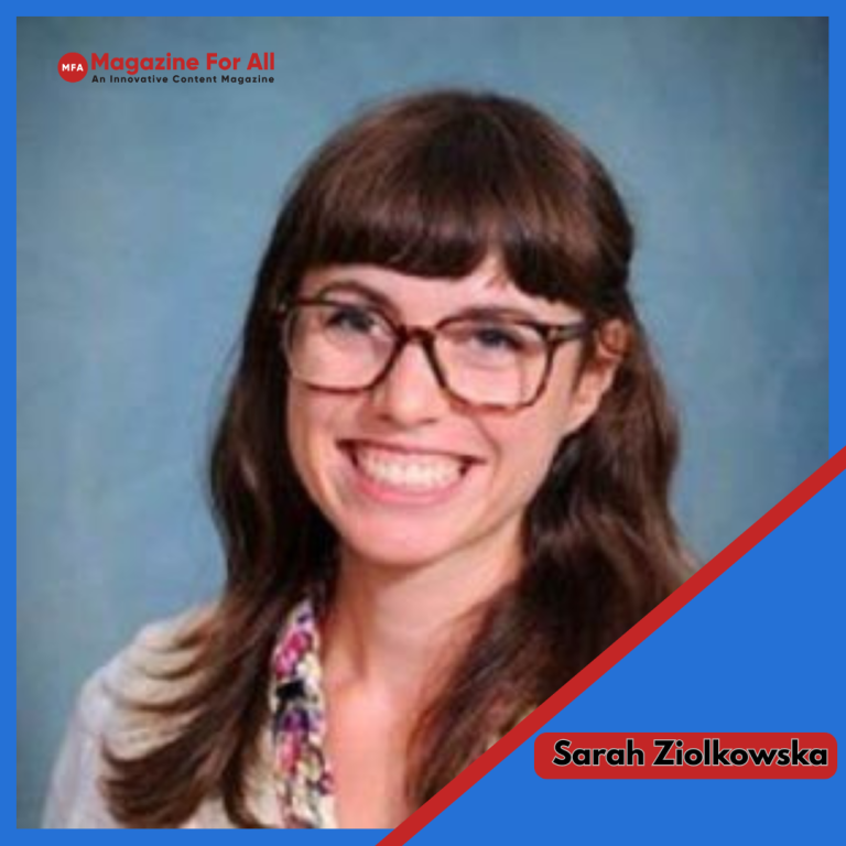 Sarah Ziolkowska, wearing glasses, poses in front of a blue background, known as comedian Nathan Fielder’s ex-wife.